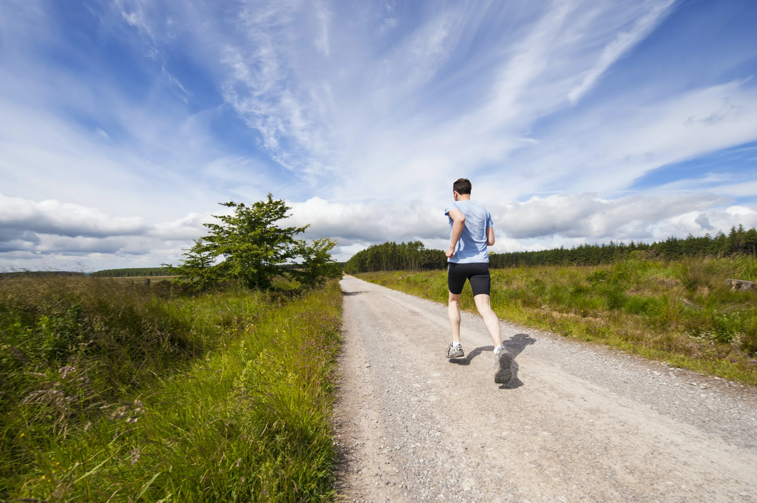 Cardio, man running down a pathway